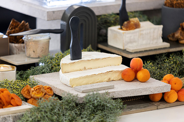 Cheese, crackers and fruits in brand colour orange