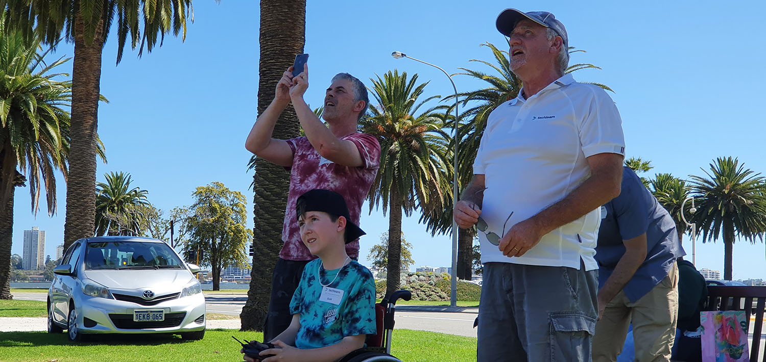 people looking up in the sky