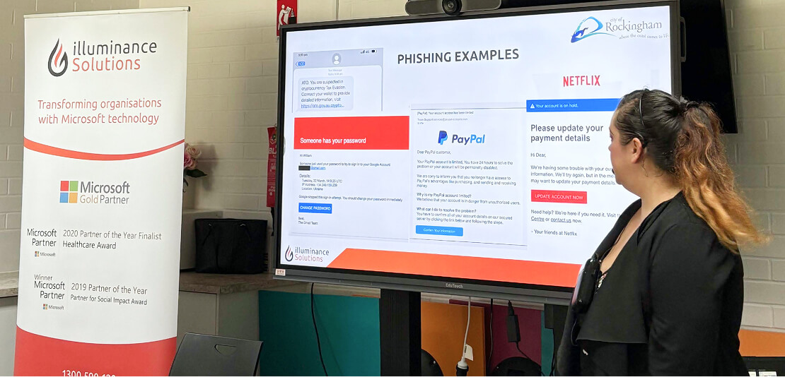 Alison pointing to phishing examples on the screen Alison Murray explaining how to spot phishing emails and online scams during senior cyber safety training